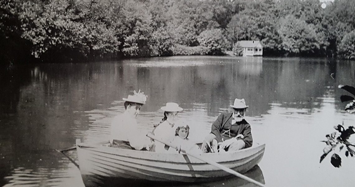 Ludwig Messel and daughters on the lake at Nymans (National Trust, Nymans Archive)