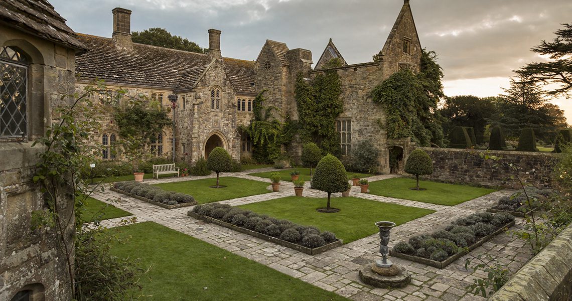 View of the Forecourt garden and exterior of the house at Nymans, West Sussex, in October.